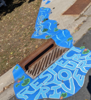 Respect your rivers paint around a storm drain