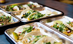 Tacos at La Dona Cerverceria served on metal trays