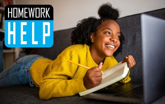 Student writing in a notebook