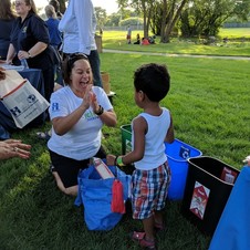 Community Recycling Ambassador teaching a child how to recycle