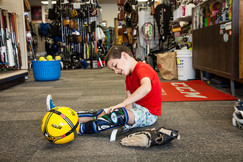 Boy trying on used sports equipment