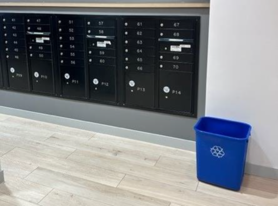 Property highlight recycling bin in mail room