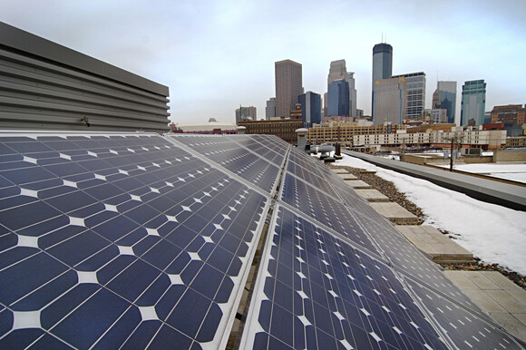 Solar panel with downtown Minneapolis buildings in background