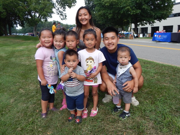 Hmong family poses in park