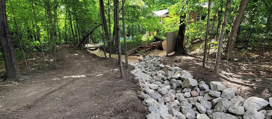 Dry creek bed to stabilize hill