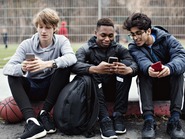 Teens with phones SharePoint image