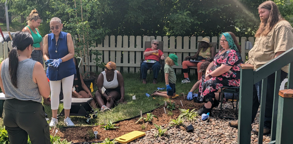 People learning from each other at a gardening workshop