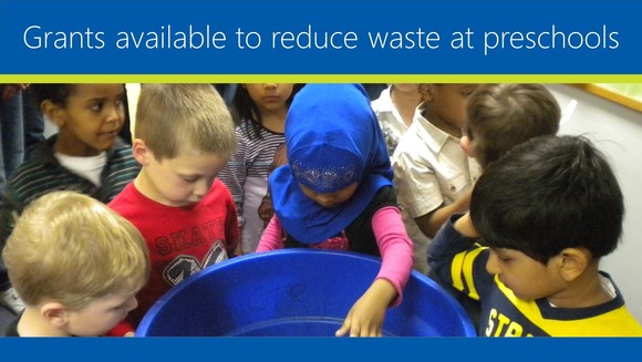Grants available to reduce waste at schools. Preschool students work together to put things in a recycling bin. 