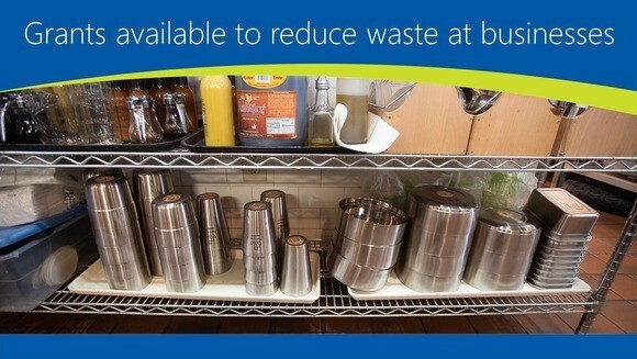 Photo of reusable containers on a shelf at a business with text grants available to reduce waste at businesses