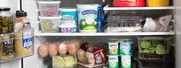 Fridge with eggs, spinach, milk, yogurt, carrots and more