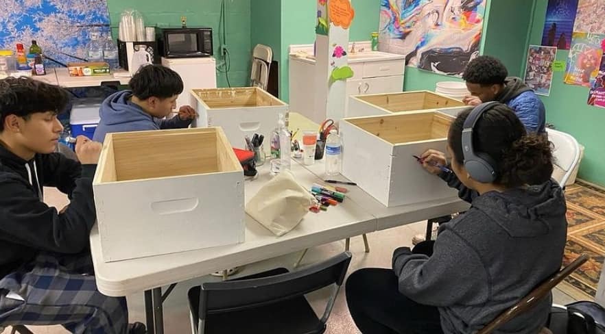 Youth decorate bee boxes