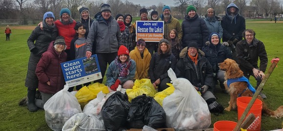 Volunteers posing with the waste they collected during the cleanup