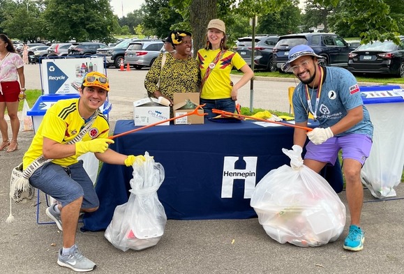 People smiling at an event after picking up waste