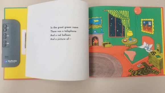 photo of a read-along book, showing a paper picture book with embedded speaker on the left