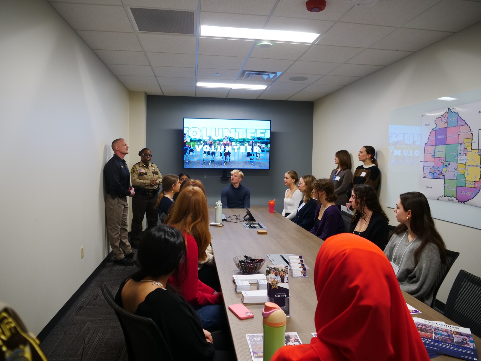 Commissioner Edelson's intern cohort listens to employees from the Sheriff's Office.