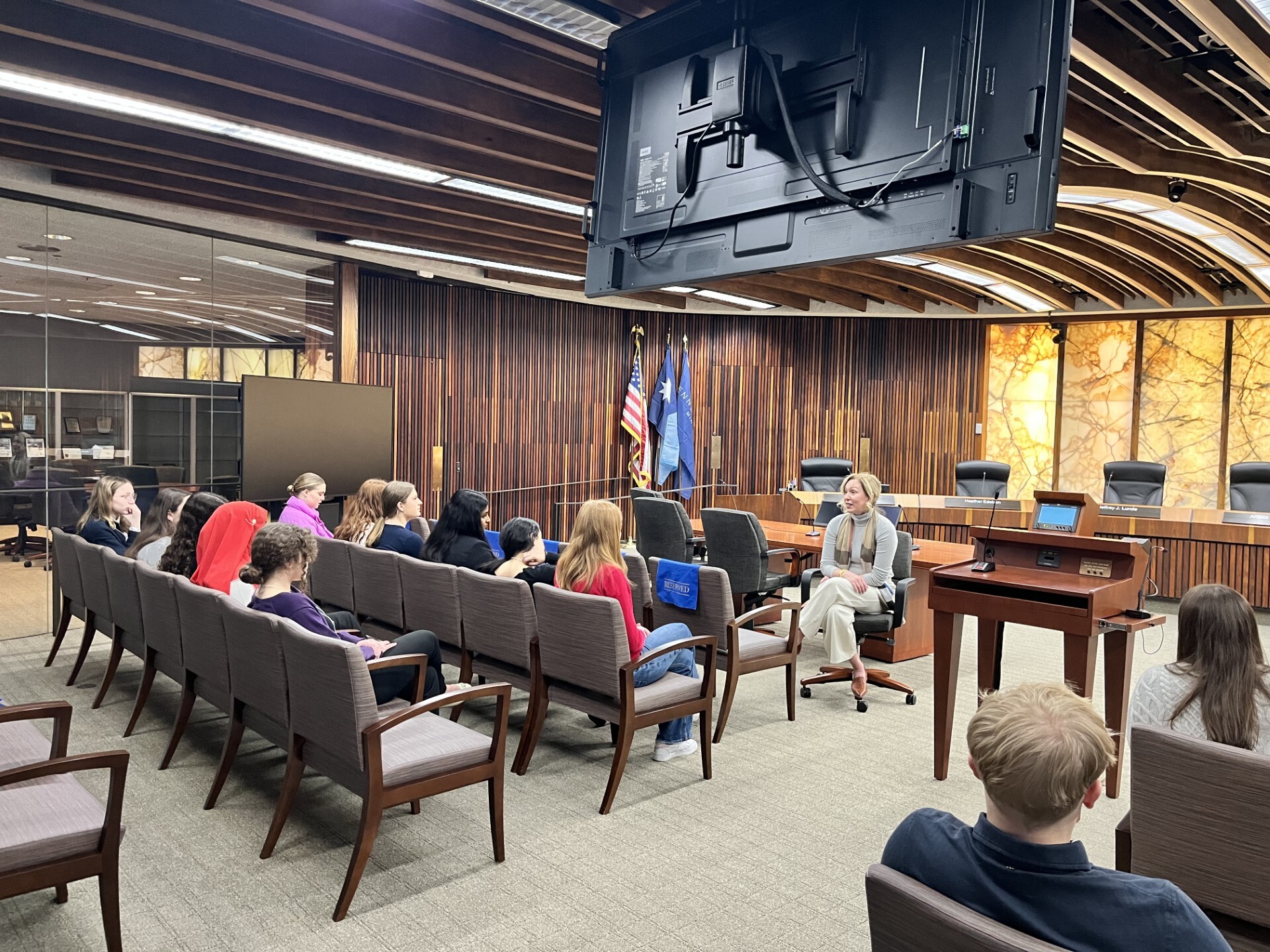 Commissioner Edelson speaks to her interns in the County Board meeting room.