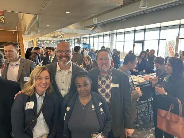 Commissioner Edelson poses with elected officials and community leaders at the 2025 Met Council State of the Region event.