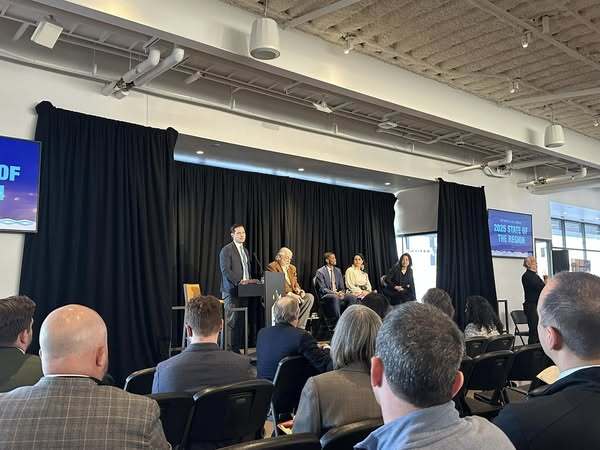 A photo of a panel discussion at the 2025 Met Council State of the Region, held at Allianz Field in St. Paul.