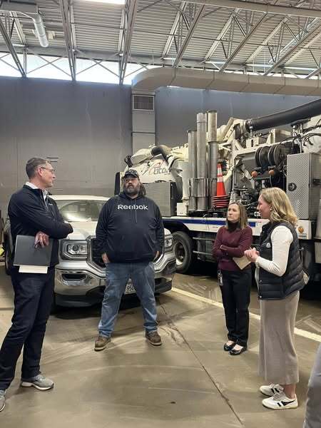 Commissioner Edelson tours the Hennepin County Public Works facility in Medina and is in discussion with staff.