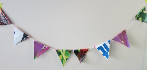 Repurposed banner made into a pendant decoration garland