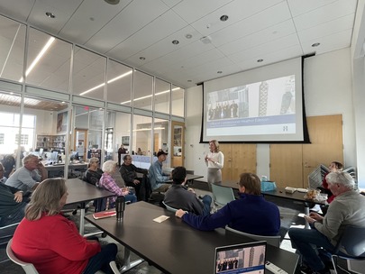 Heather presents to a group of constituents at the Excelsior Library during her Coffee with the Commissioner event.