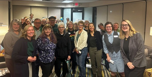 Commissioner Edelson poses with Commissioner Greene and members of ISAIAH in a room at the MyHealth clinic in Hopkins.
