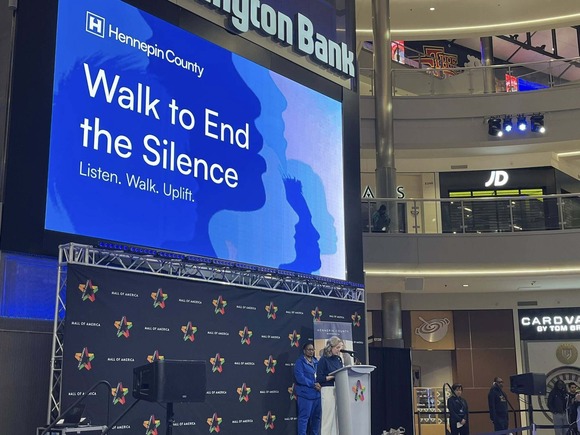 Heather speaks in the Mall of America rotunda at the Walk to End Silence.
