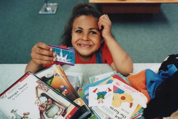 Child with library card