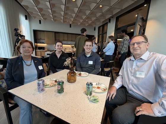 Four people sitting around a table