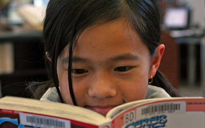 child reading a book