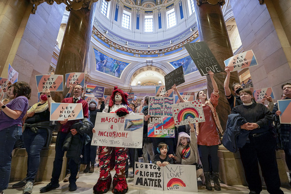 Opponents of HF12 rally outside House Chamber