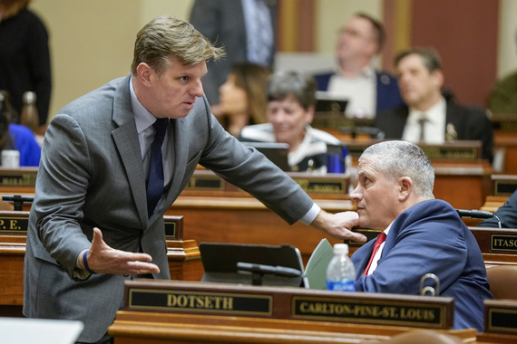 House members talk during a floor session
