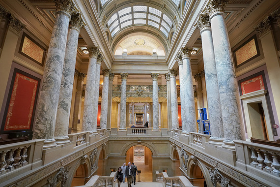 Capitol visitors climb the grand staircase