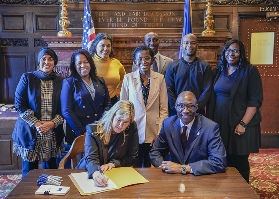 Signing the enrollment for the CROWN Act