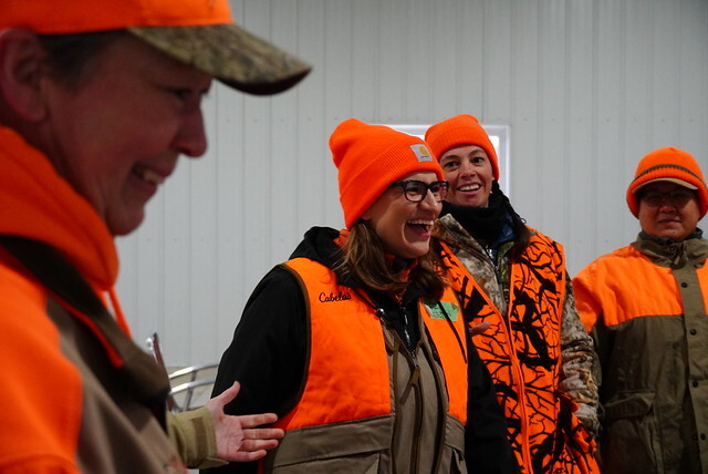 Lt. Gov Flanagan, Rep. Her, and two others wearing blaze orange