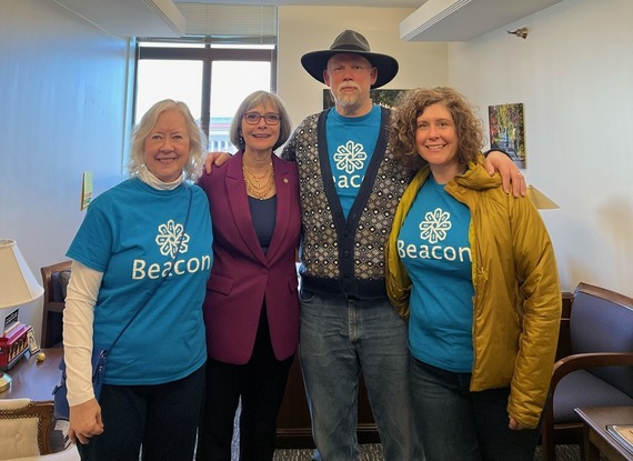 Rep. Klevorn poses with Beacon Interfaith Housing advocates for a photo