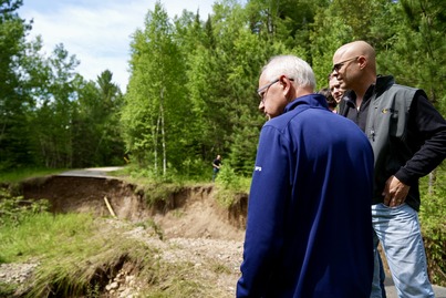 Gov Walz, Rep Liselgard, and Sen Hauschild examine washed out road