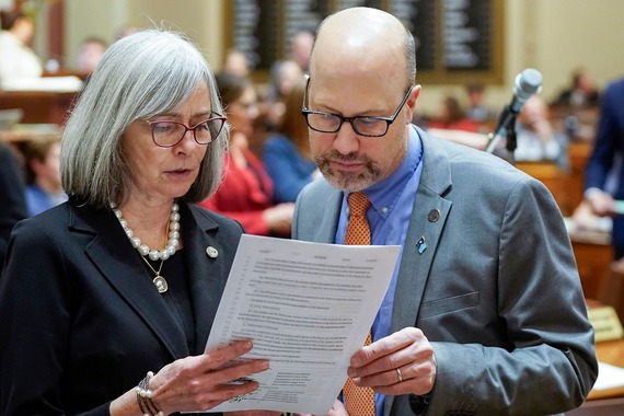 Rep. Klevorn and Rep. Pinto review a bill on the House Floor