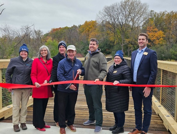 Ribbon cutting event photo with city staff