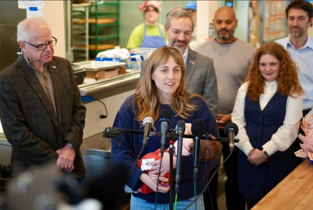 Parent with baby at Paid Family and Medical Leave press event