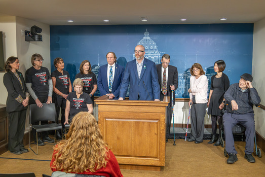 Tabke speaking at Parkinson's legislation press conference with patients and advocates