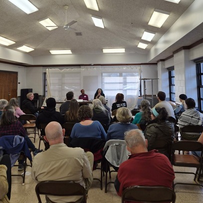 Photo of crowd and Rep. Mahamoud and Gomez at recent town hall