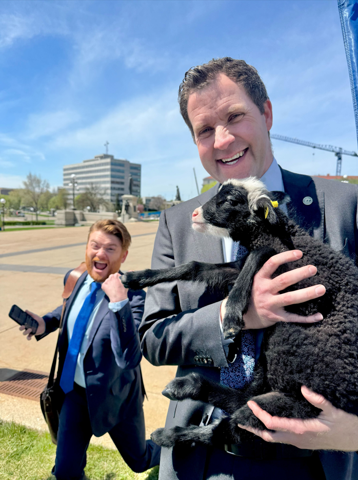 Long holding lamb w Rep Smith