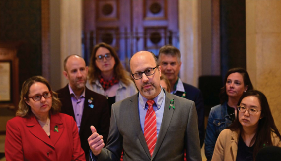 Rep. Pinto speaking at press conference in front of House chamber and other lawmakers