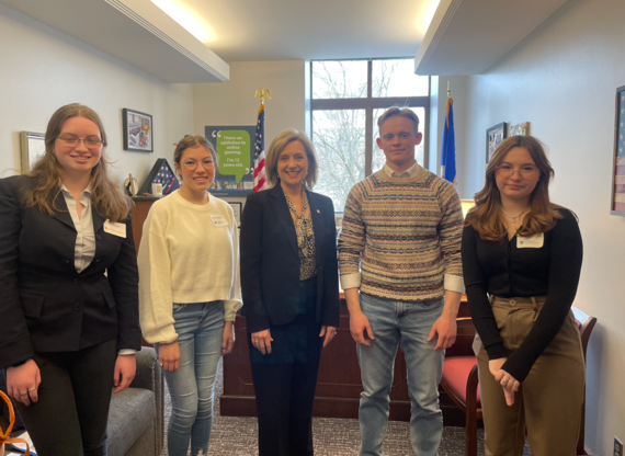 Robbins with students