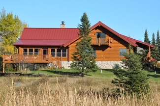 Home with Northern Lights Manufacturing Roof