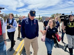Governor Tim Walz and Commissioner Ida Rukavina surveying storm damage in Cook, Minnesota