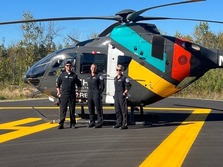 North Memorial’s Air Care Helicopter Pilot Wes Caple and Medical Crew Members Linda Roberts and Olivia Tokarczyk at paved helipad.   