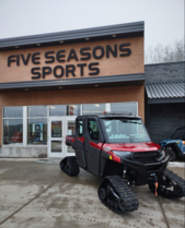 Polaris side-by-side in front of Five Seasons Sports 