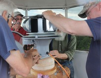 Volunteers install the beacon at the Two Harbors Lighthouse 
